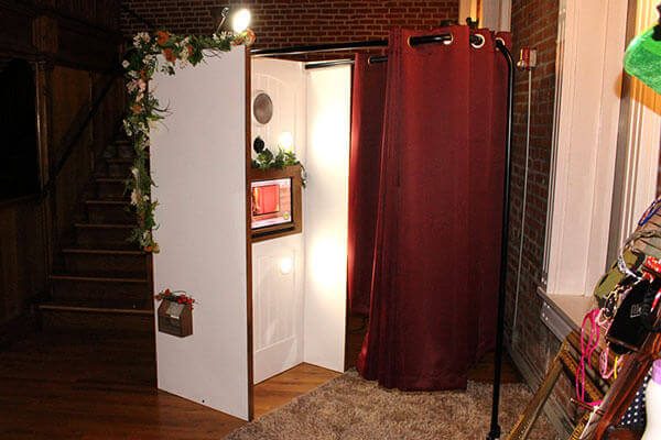 Elegant white booth at a wedding reception